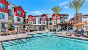 Our apartments offer a swimming pool with a variety of chairs and umbrellas